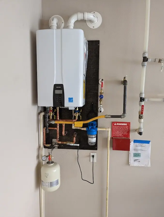 Professional plumber installing copper piping in a Mandeville home